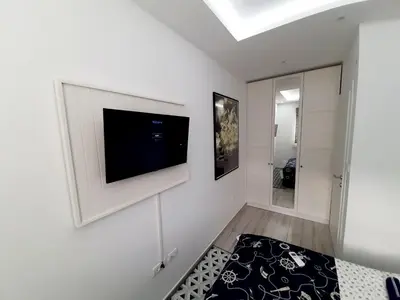 a living room with a flat screen tv on a wall at Maritimo di Cattaro****Lux Apartment with Garage in Kotor