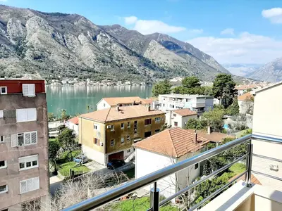 a view of a city and a lake from a balcony at Maritimo di Cattaro****Lux Apartment with Garage in Kotor