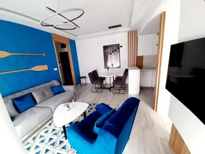 a living room with a couch and a table at Maritimo di Cattaro****Lux Apartment with Garage in Kotor