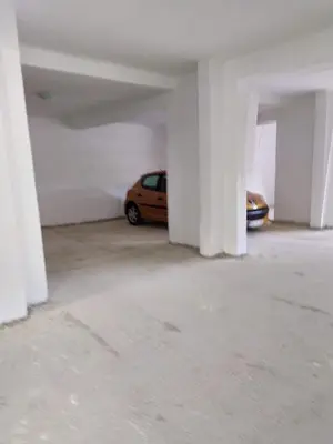 a parking garage with a car parked in it at Fiore di Cattaro **** Lux Apartment with Parking in Kotor