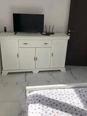 a white dresser with a television on top of it at Apartment Apollo 2 in Kotor