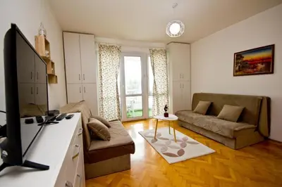 a living room with a couch and a tv at Apartment Terassa in Bar