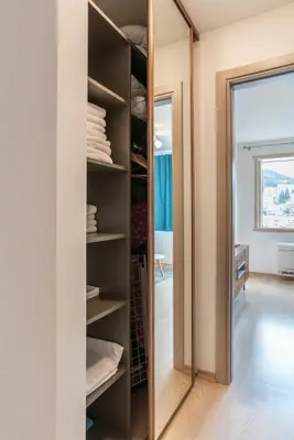a walk in closet with a large mirror at Fontana Mediteran Properties in Budva
