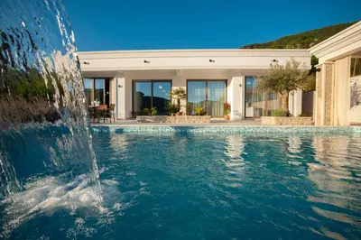 a water fountain in front of a house at Villa Salute in Budva