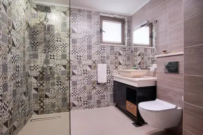 a bathroom with a toilet and a sink and a shower at Villa Salute in Budva