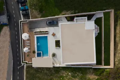an overhead view of a house with a large billboard at Villa Salute in Budva