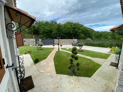 a view of a garden from a house at Apartments Monte Green in Virpazar