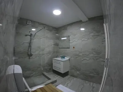 a bathroom with a shower and a sink at Villa WOLF in Budva