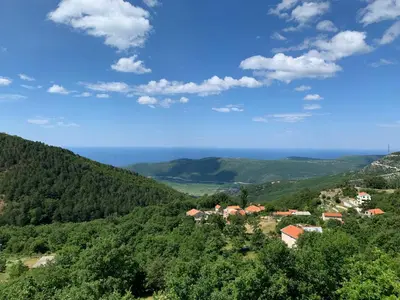 a view of a village in the hills at Villa WOLF in Budva