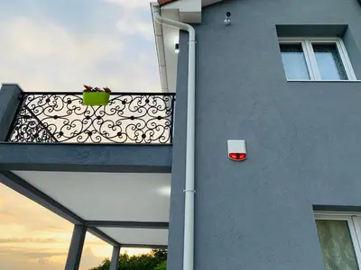 a balcony of a building with a plant on it at Villa WOLF in Budva