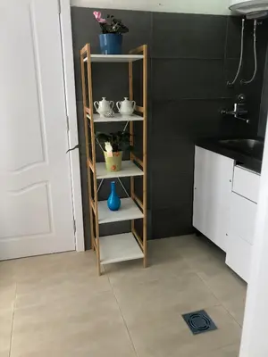 a shelf in a kitchen with pots and vases on it at Casa Alea in Ulcinj