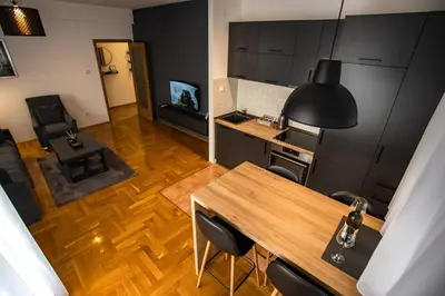 an overhead view of a living room with a table and chairs at Apartment Podgorica in Podgorica