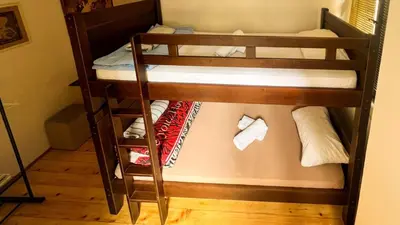 a couple of bunk beds in a room at Old Town Homestel in Kotor