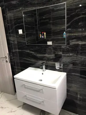 a bathroom with a white sink and a mirror at Adriatic Oasis in Bar