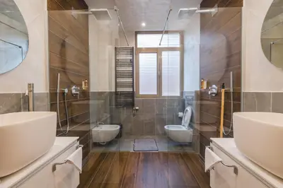 a bathroom with two sinks and two toilets at Villa Solaria in Sveti Stefan