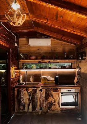 a kitchen with a stove and a sink in a room at Sojenica Pustolov - Ada Bojana in Ulcinj