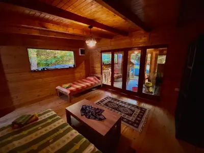 an overhead view of a living room in a log cabin at Sojenica Pustolov - Ada Bojana in Ulcinj