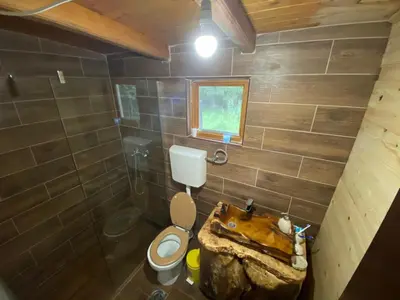 a small bathroom with a toilet and a sink at Sojenica Pustolov - Ada Bojana in Ulcinj