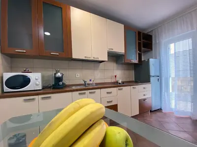a kitchen with a bunch of bananas on a counter at Family Beachfront Apartment in Petrovac na Moru