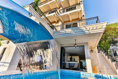 a water fountain in front of a building at Boutique Hotel Tate By Aycon in Budva