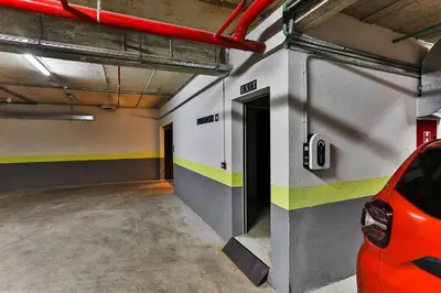 a parking garage with a car parked in it at Boutique Hotel Tate By Aycon in Budva