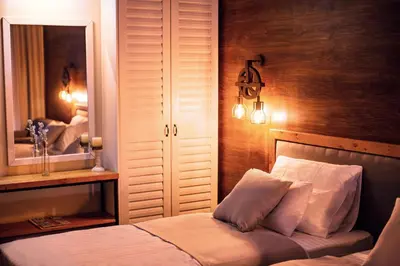 a bedroom with a bed and a mirror at Boutique Hotel Tate By Aycon in Budva
