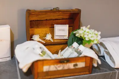 a wooden box with a bouquet of flowers in it at Boutique Hotel Tate By Aycon in Budva