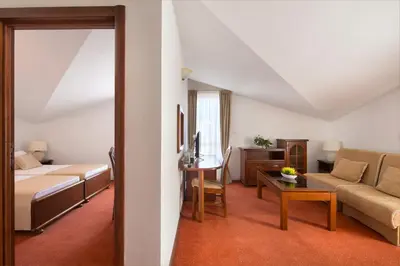 a living room with a bed and a couch at Villa Ljubanovic in Budva