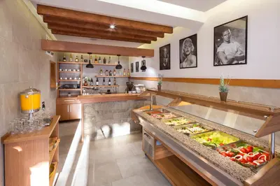a kitchen with a buffet with vegetables on it at Villa Ljubanovic in Budva
