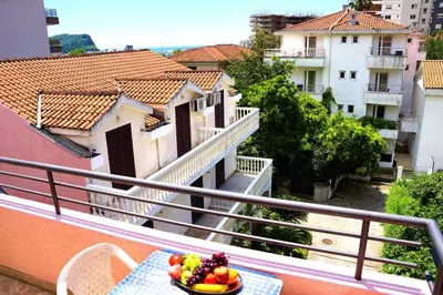 a bowl of fruit on a table on a balcony at Apartments Stanivukovic in Budva