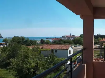 a balcony of a house with a view of the ocean at Apartments Stanivukovic in Budva