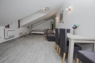 a living room with a couch and a table at Hotel Dapčević in Cetinje