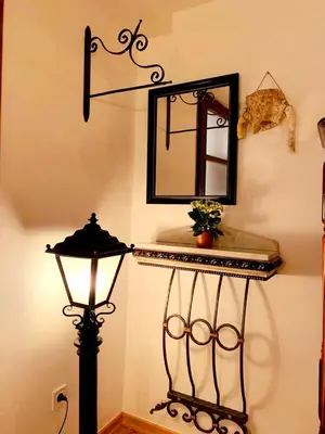 a mirror and a lamp and a sink in a room at Villa Urbana, Old Town Budva in Budva