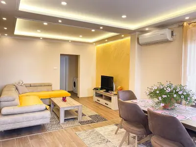 a living room with a couch and a table at ANDI Apartment in Ulcinj