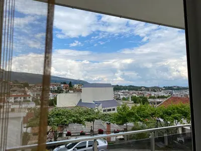 a view of a city from a window at ANDI Apartment in Ulcinj