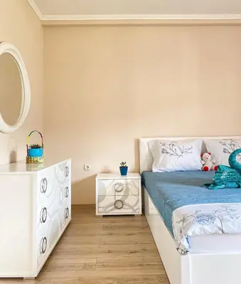 a bedroom with a bed and a mirror at ANDI Apartment in Ulcinj