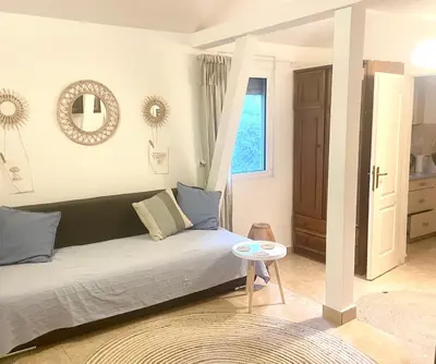 a living room with a couch and a table at Anna Apartment in Utjeha