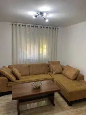 a living room with a couch and a coffee table at Apartman 02 in Bar