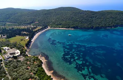 an aerial view of a beach and the ocean at Cottage Four Olives in Ulcinj
