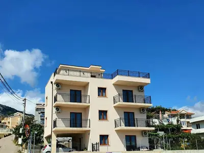 a tall building with balconies on the side of it at Family Apartments in Bar