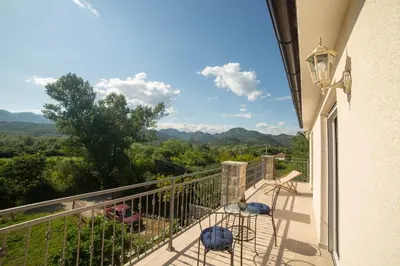 a balcony with a view of the mountains at Plamenatz studio apartments in Virpazar