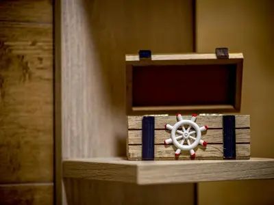 a wooden shelf with a steering wheel on it at Square Point Apartments in Kotor