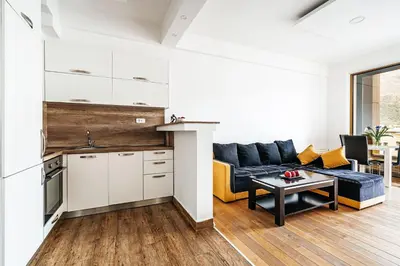 a living room with a couch and a table at Victoria Top View in Budva