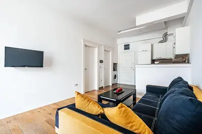 a living room with a couch and a table at Victoria Top View in Budva