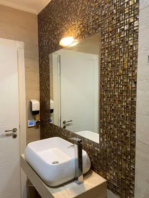 a bathroom with a sink and a mirror at Victoria Top View in Budva