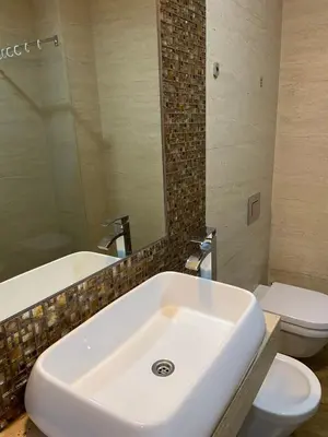 a bathroom with a white sink and a toilet at Victoria Top View in Budva