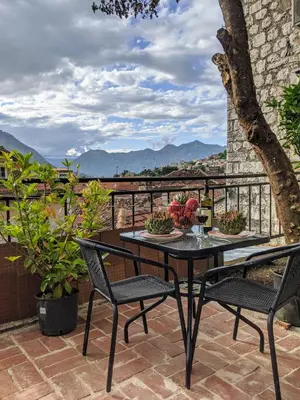 a table and chairs on a patio with a view at Best view! Rooftop with Garden - Old Town Nr404 in Kotor