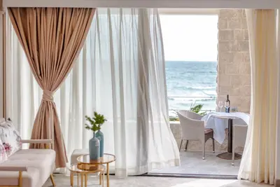a living room with a view of the ocean at Plaza Hotel&SPA in Ulcinj