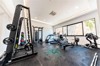 a gym with treadmills and machines in a room at Plaza Hotel&SPA in Ulcinj