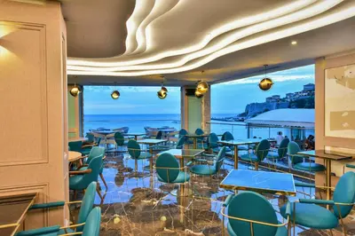 a restaurant with a view of the ocean at Plaza Hotel&SPA in Ulcinj